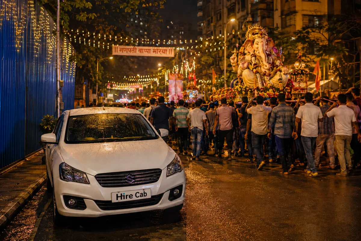 Ganpati visarjan procession on a Mumbai street at night with a HireCab sedan waiting at the kerb